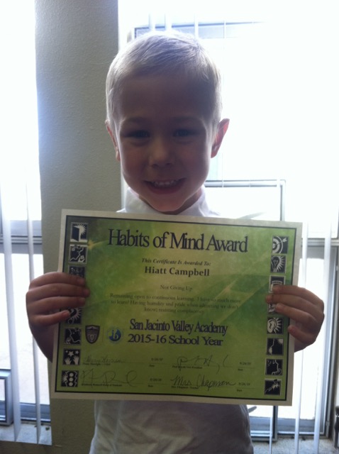 A photo of Hiatt with his award